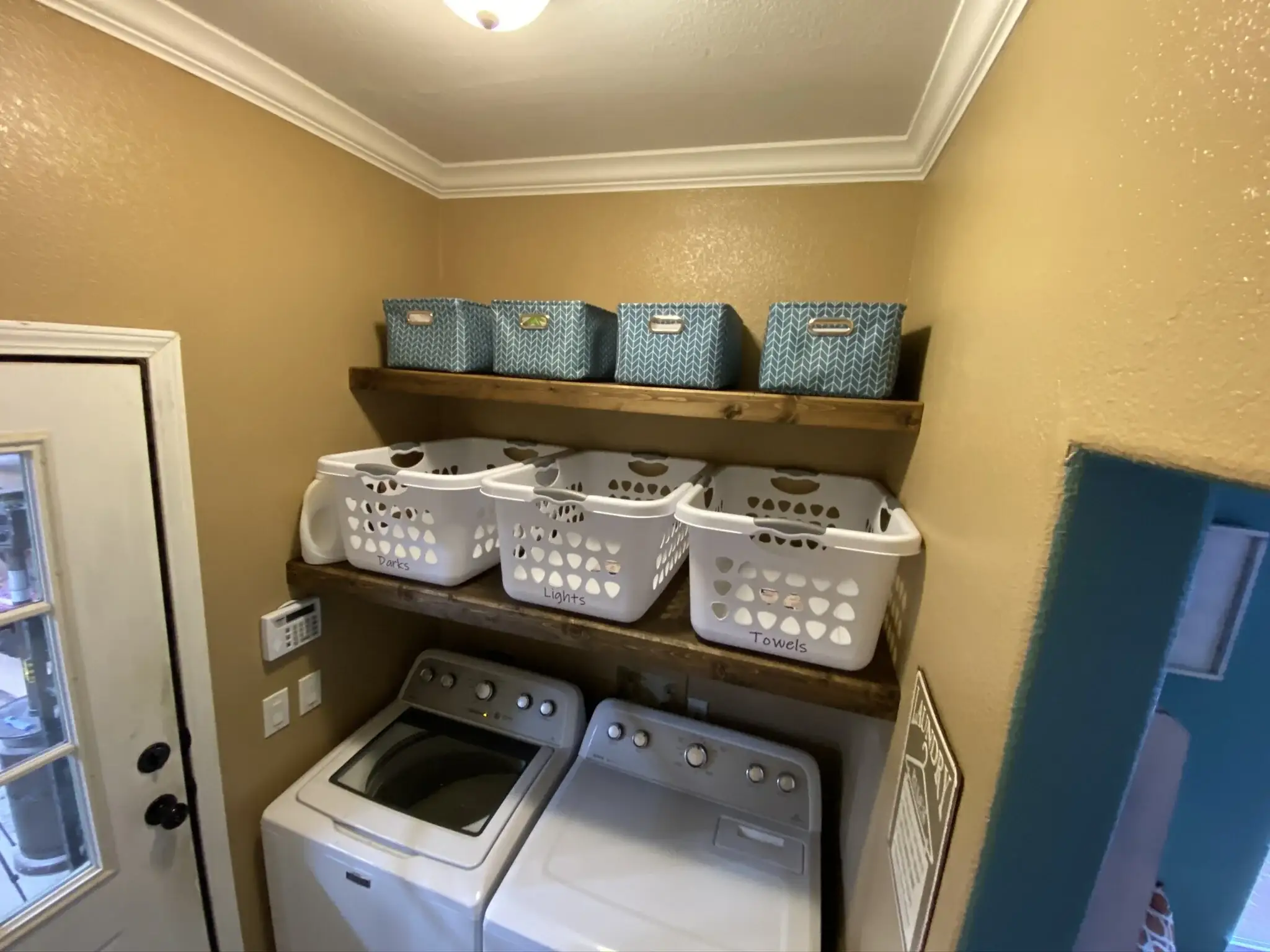Install Floating Shelves Above the Washer and Dryer